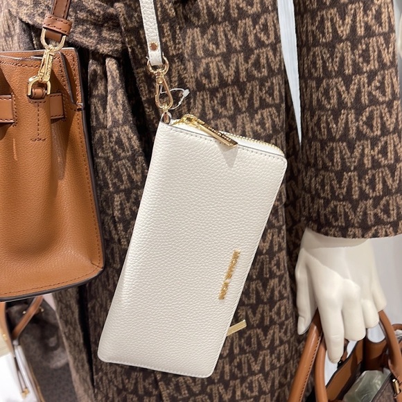 Michael Kors Handbags - MICHAEL KORS LARGE TRAVEL CONTINENTAL WRISTLET WALLET OPTIC WHITE COLOR